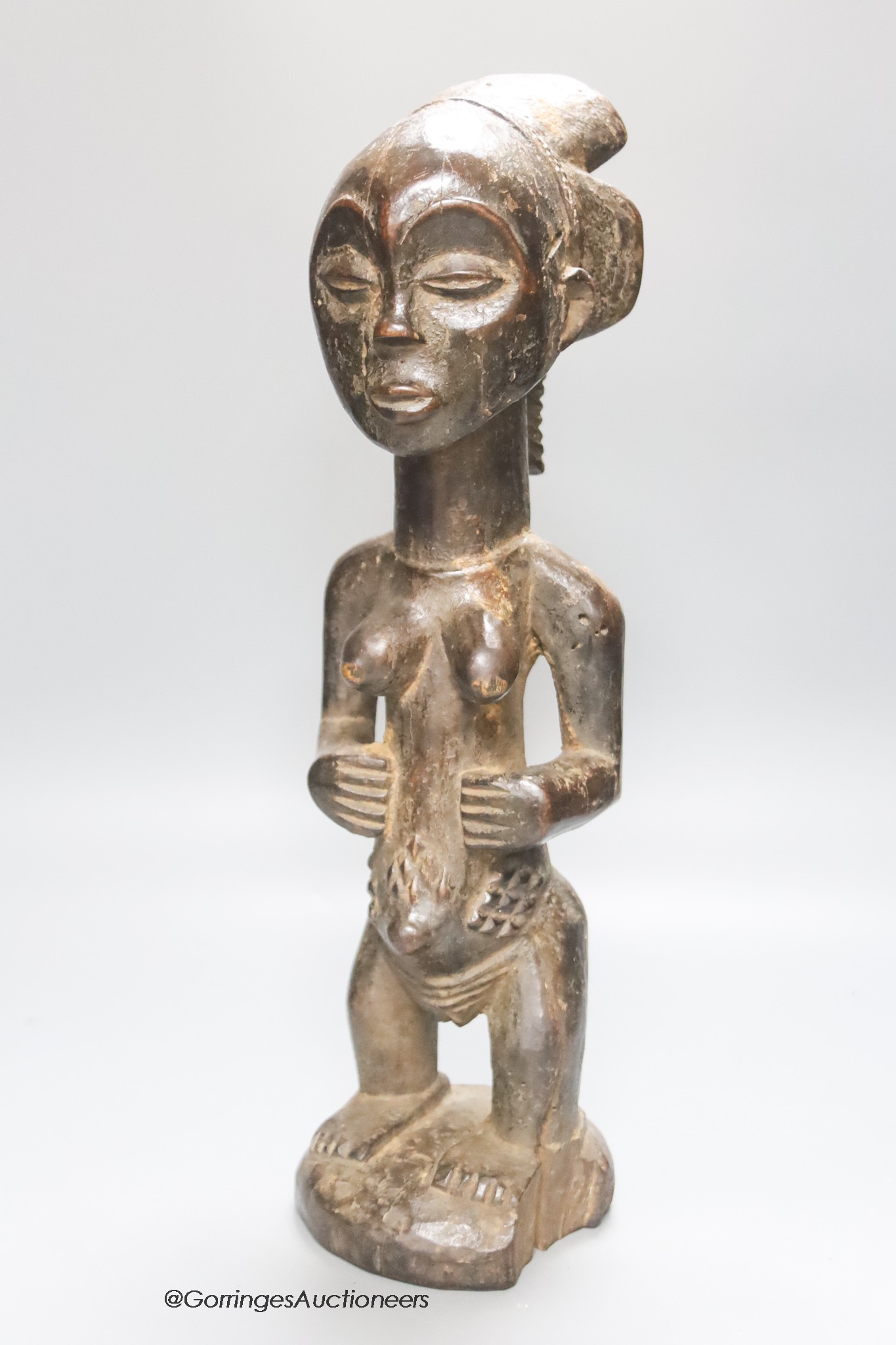 An African Luba tribal wood maternity figure, height 45cm